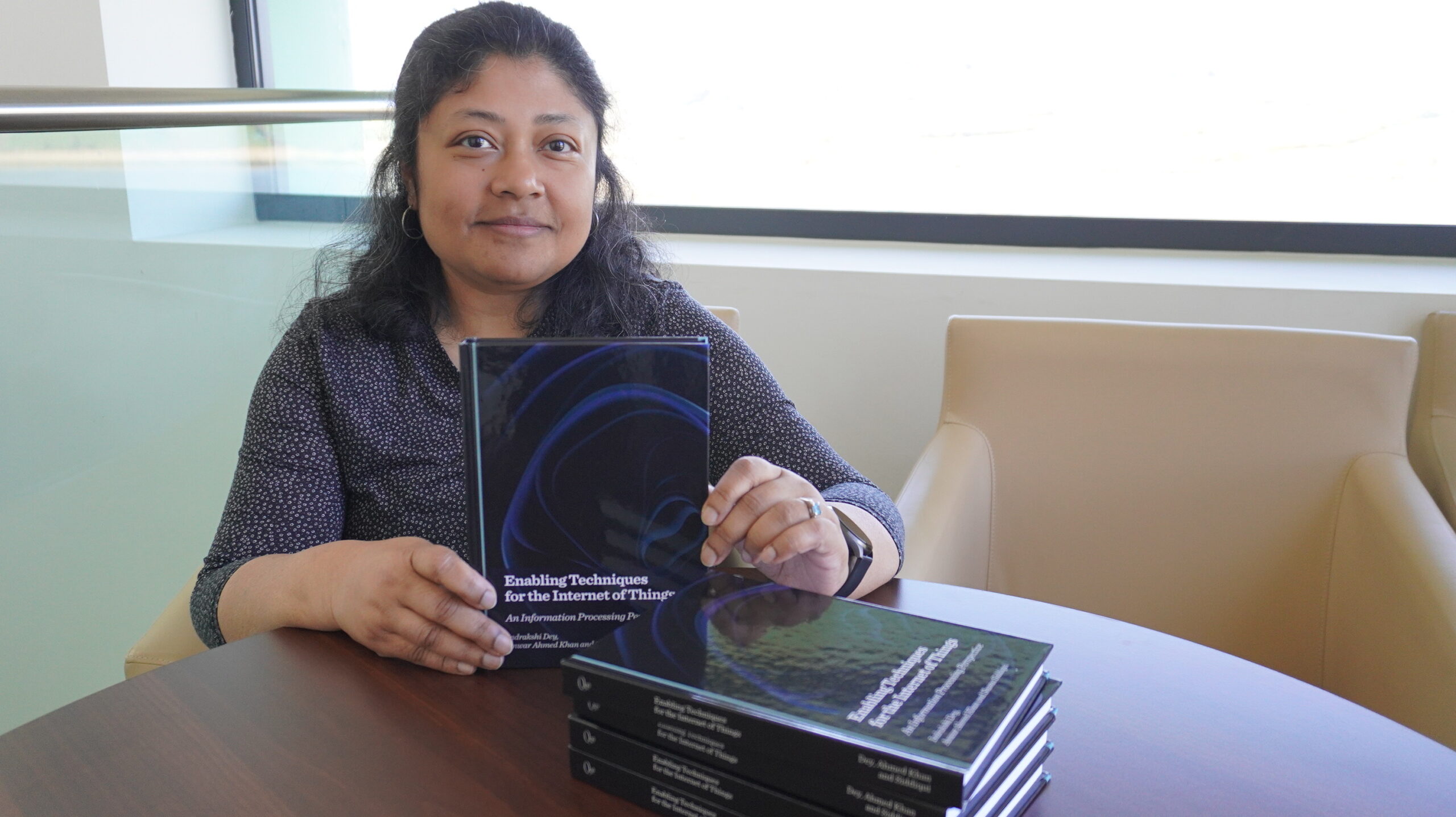 Dr Indrakshi Dey holding a copy of her new book